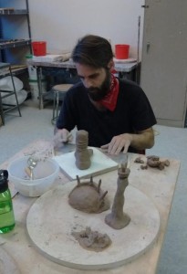 Nico Grum creating clay sculptures.png