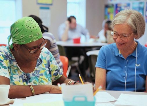 Two adults in literacy tutoring workshop at Seeds of Literacy Cleveland