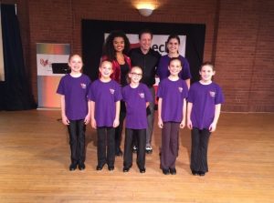 Tap dancers pose in group photo