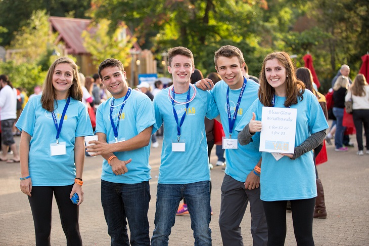 A group of teens pose outside during LifeAct's Into the Light Walk