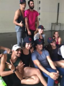 Malpaso dancers model their new Cleveland Indians baseball caps
