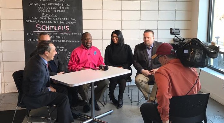 Lillian Kuri seated with other Cleveland Chain Reaction investors during an interview to announce the series.