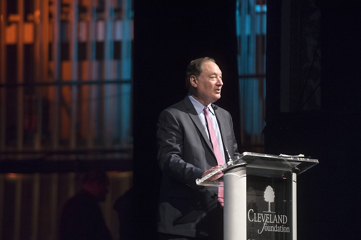 Cleveland Foundation President and CEO Ronn Richards stands at podium onstage at annual meeting