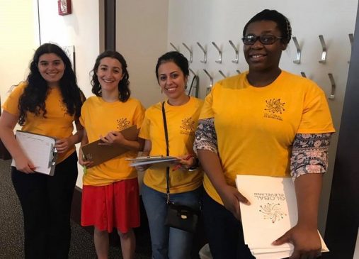 Four Global Cleveland volunteers pictured at a naturalization ceremony