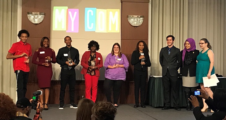 The 2017 MyCom Youth Voice Awards Youth Category winners stand onstage with their awards