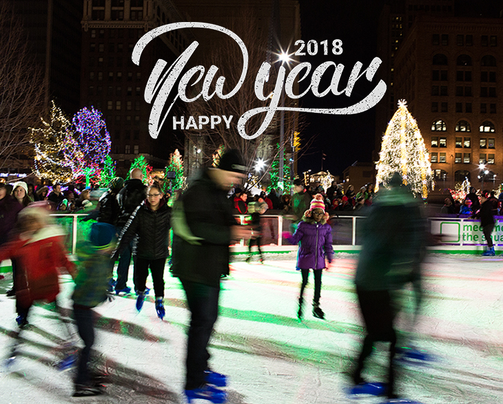 People skating on Cleveland Foundation Skating Rink with Happy New Year graphic