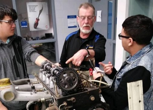 WIRE-Net instructor helps students work on motor