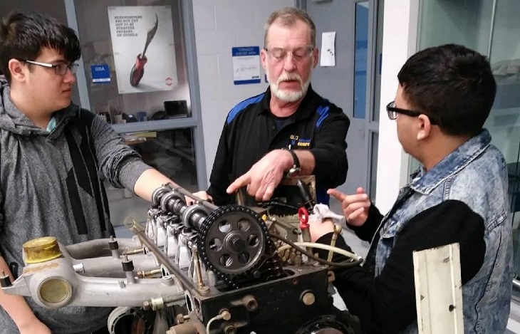 WIRE-Net instructor helps students work on motor