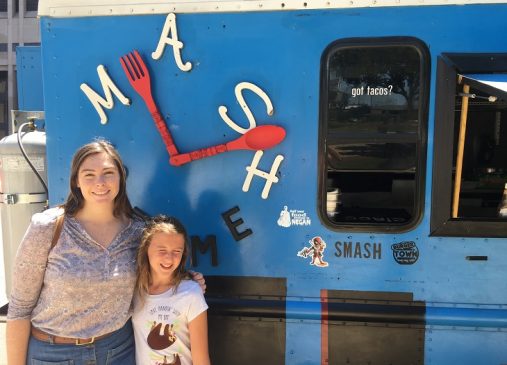 Image of Monica and a girl in front of a food truck