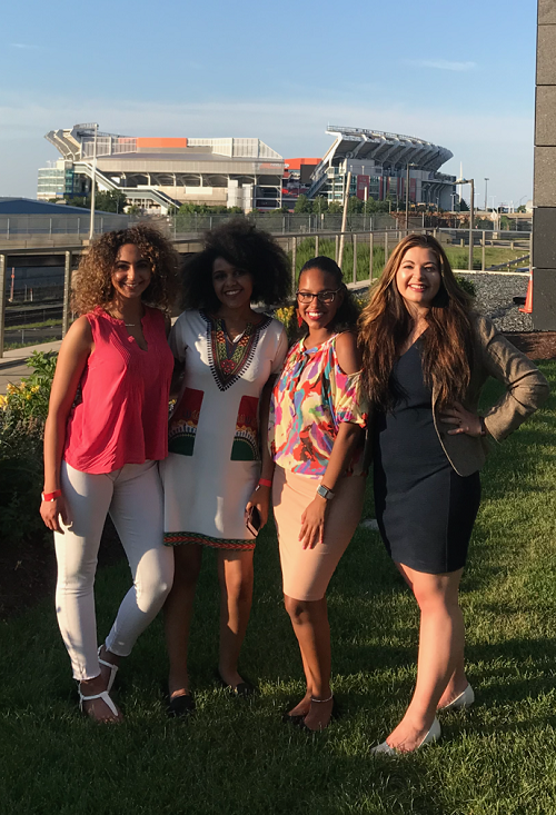 Simone and three other women stand in front of Browns Stadium 