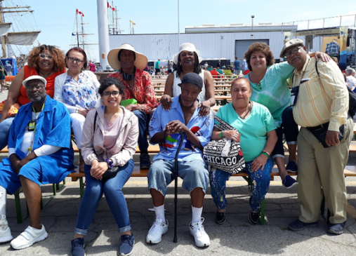 Hakmat and a group of seniors at the Tall Ships Festival