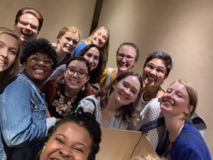 A group of summer interns pose for a selfie