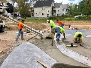 Volunteers constructing a labyrinth walkway in the park that will give residents a space to exercise and connect with neighbors.