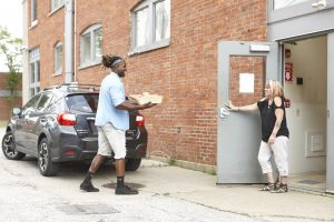 Man delivering box of food