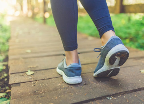 Photo of person walking along trail