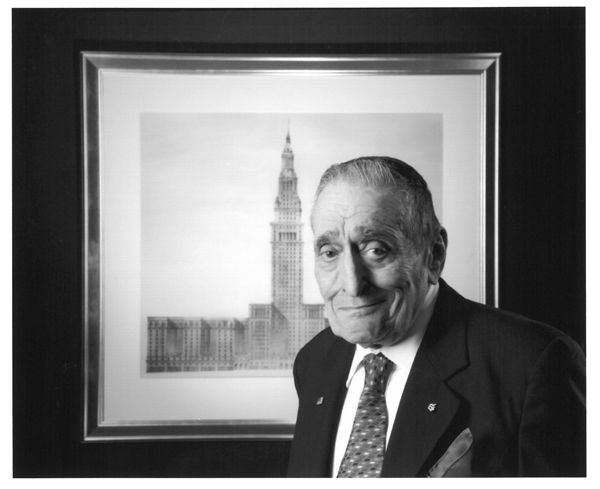 Sam Miller stands in front of framed picture of Terminal Tower