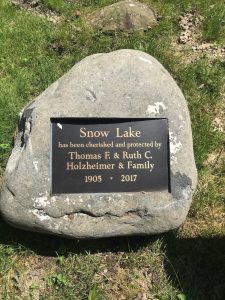 Stone with sign recognizing donors at Snow Lake