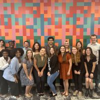 Group photo of Cleveland Foundation summer interns in front of a colorful wall