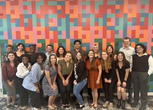 Group photo of Cleveland Foundation summer interns in front of a colorful wall