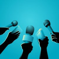 hands with microphones against blue background