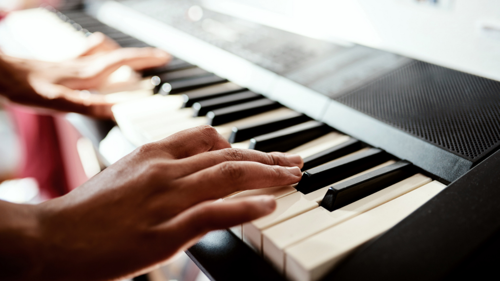 Hands on piano keys