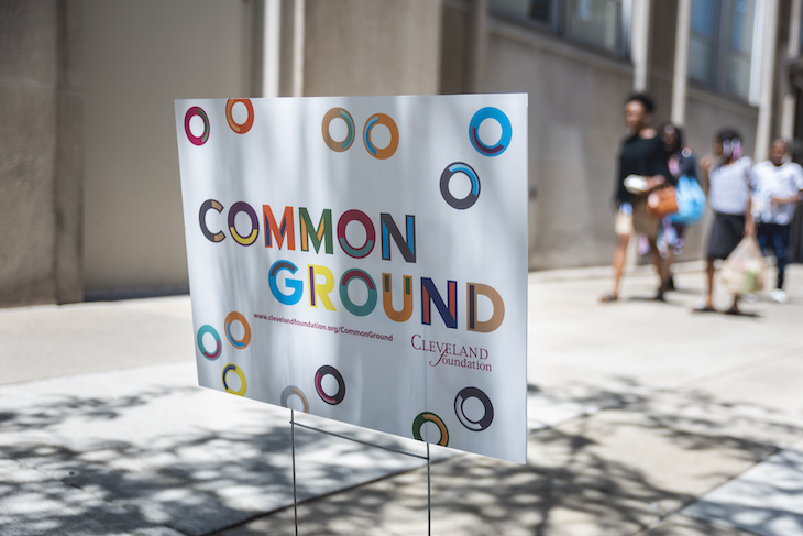 A Common Ground yard sign is pictured outside an event location