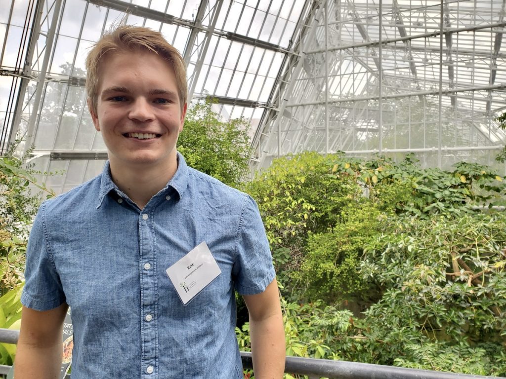 Eric Grimm stands in Cleveland Botanical Gardens Greenhouse