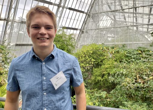 Eric Grimm stands in Cleveland Botanical Gardens Greenhouse