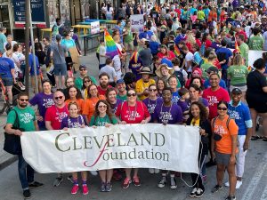 Cleveland Foundation staff members in the march hold a Cleveland Foundation banner 
