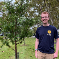 Photo of Thomas Vodrey standing by tree