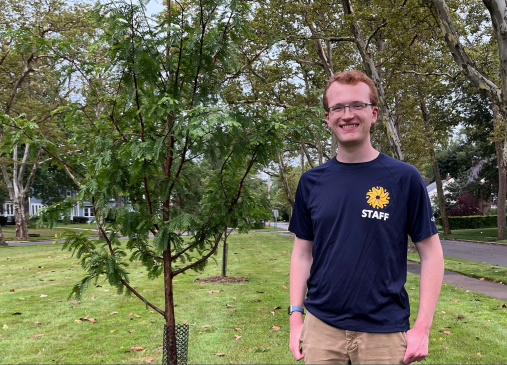 Photo of Thomas Vodrey standing by tree