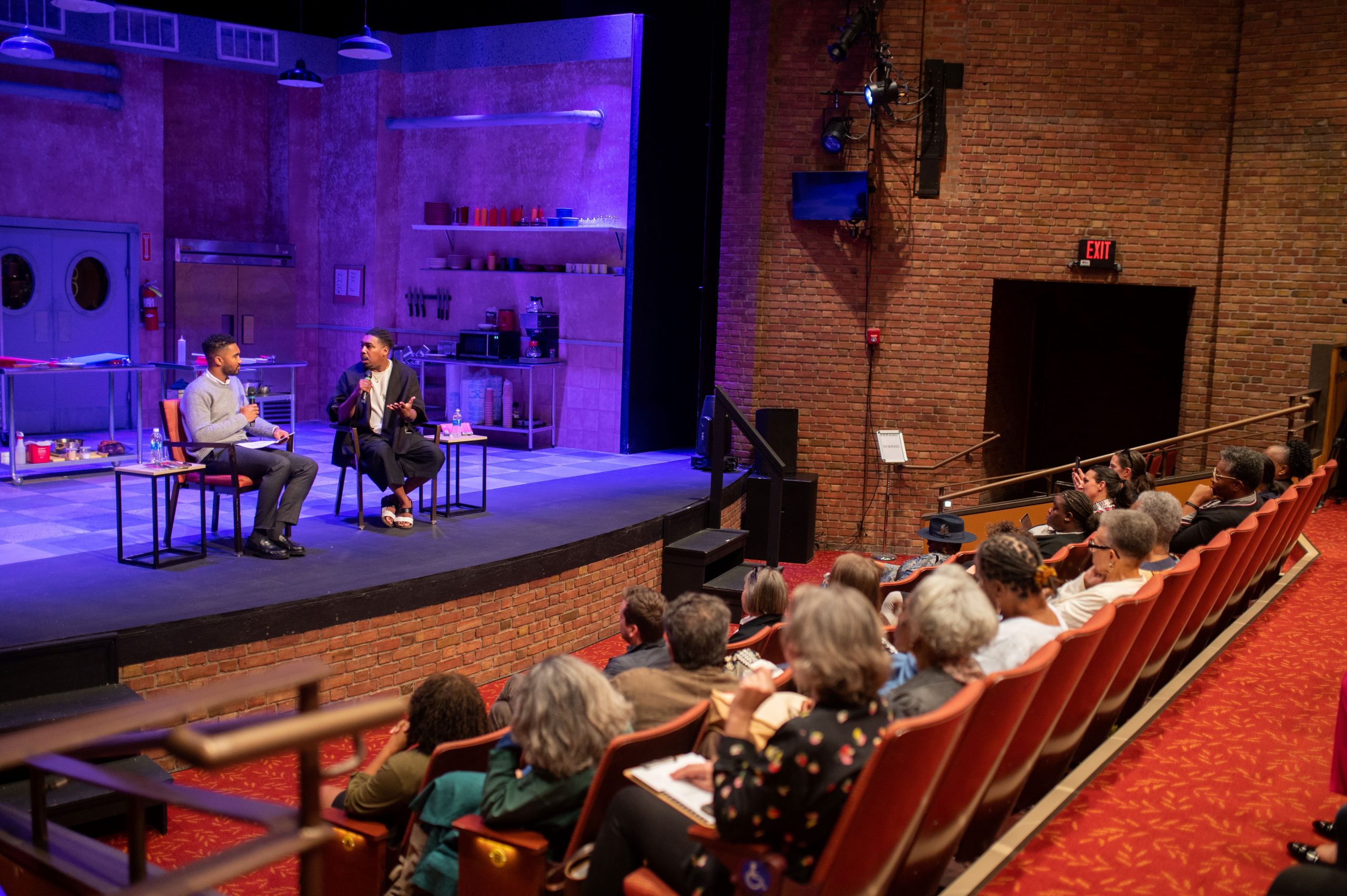 Zachary Thomas and Saeed Jones on stage at Karamu House